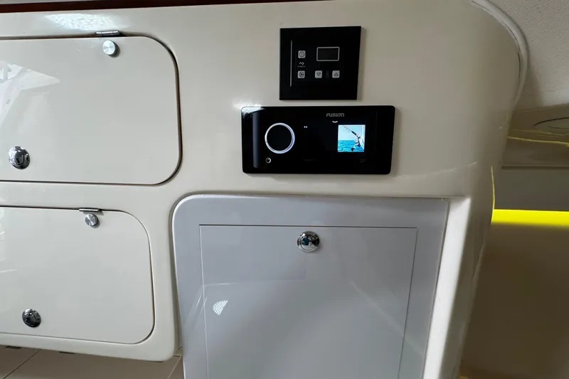  Yacht Photos Pics Control panel and storage on 2001 Grady-White Express 330 boat interior.