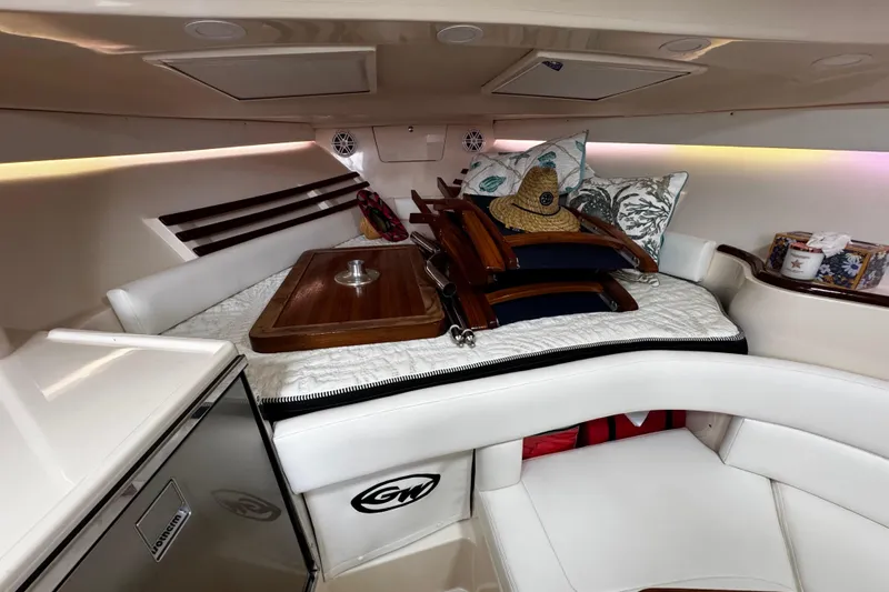  Yacht Photos Pics 2001 Grady-White Express 330 cabin interior with cushions and wooden accents.