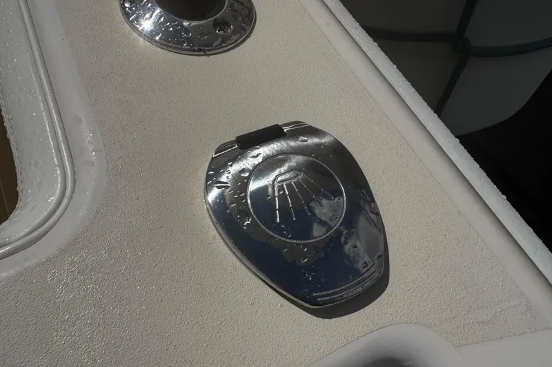  Yacht Photos Pics Chrome deck fitting on 2001 Grady-White Express 330 boat, wet with water droplets.