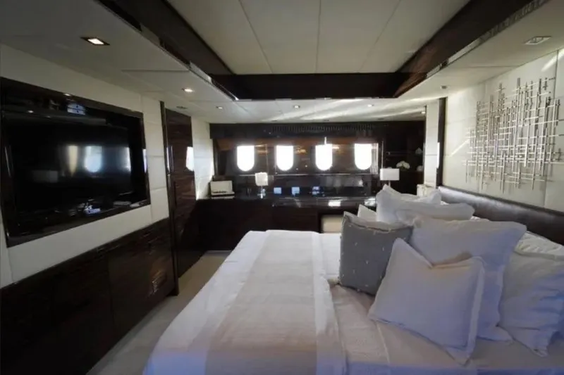  Yacht Photos Pics Luxurious bedroom interior on 2008 Leopard 112 yacht with modern decor and large windows.