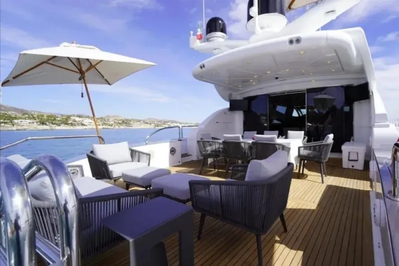  Yacht Photos Pics Luxurious Leopard 112 yacht deck with seating, umbrella, and ocean view, 2008 model.