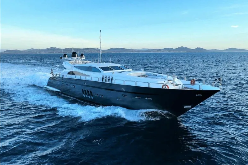  Yacht Photos Pics Luxury Leopard 112 yacht cruising on open sea, 2008 model, with scenic coastal backdrop.