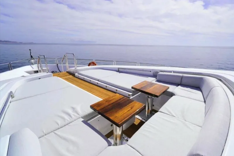  Yacht Photos Pics Luxurious 2008 Leopard 112 yacht deck with elegant seating and ocean view.