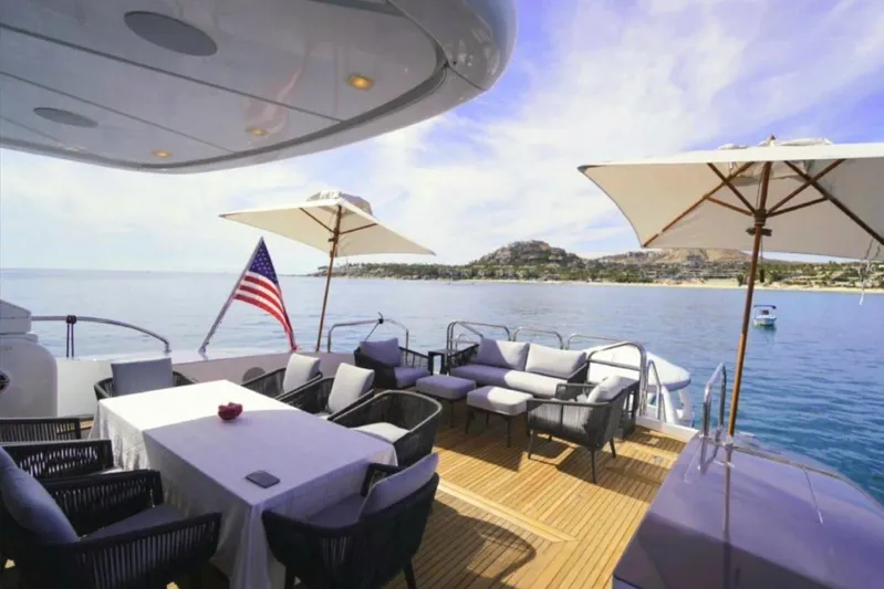  Yacht Photos Pics Luxury yacht deck with seating, umbrellas, and ocean view, Leopard 112 model, 2008.