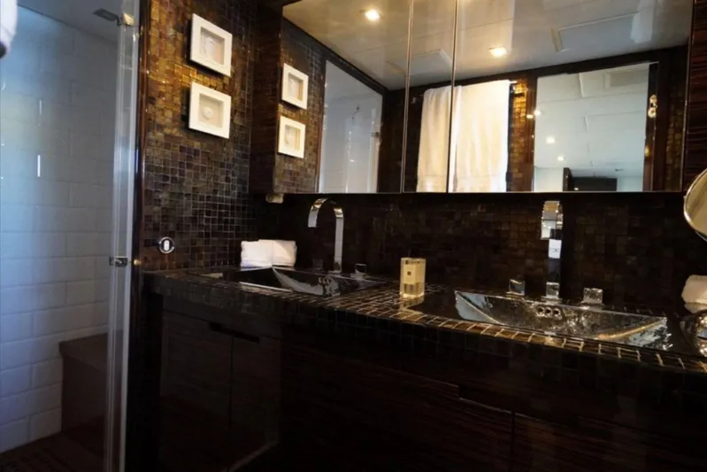  Yacht Photos Pics Luxurious bathroom with dual sinks, mosaic tiles, and modern fixtures on Leopard 112 yacht, 2008.