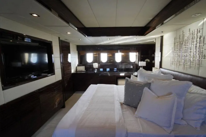  Yacht Photos Pics Luxurious bedroom interior on 2008 Leopard 112 yacht, featuring modern decor and large windows.