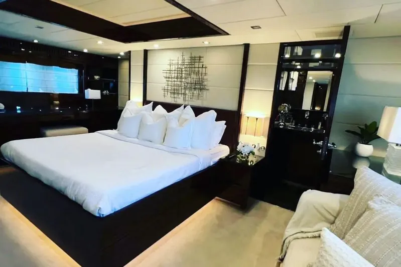  Yacht Photos Pics Luxurious bedroom interior on a 2008 Leopard 112 yacht, featuring elegant decor and ambient lighting.