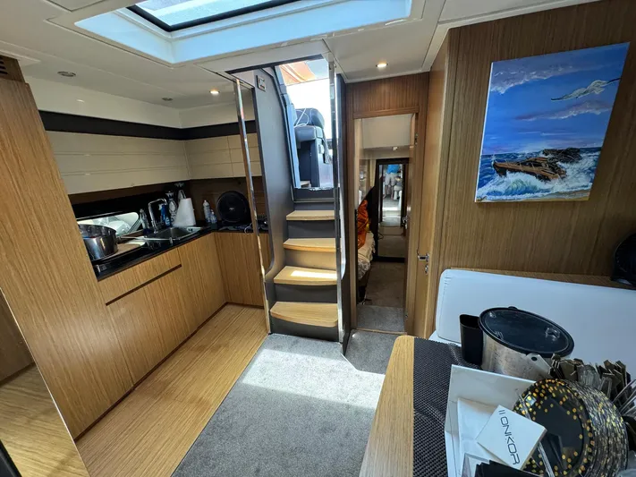 Onkor II Yacht Photos Pics Luxurious interior of 2015 Azimut Atlantis 43 yacht with modern kitchen and cozy living space.