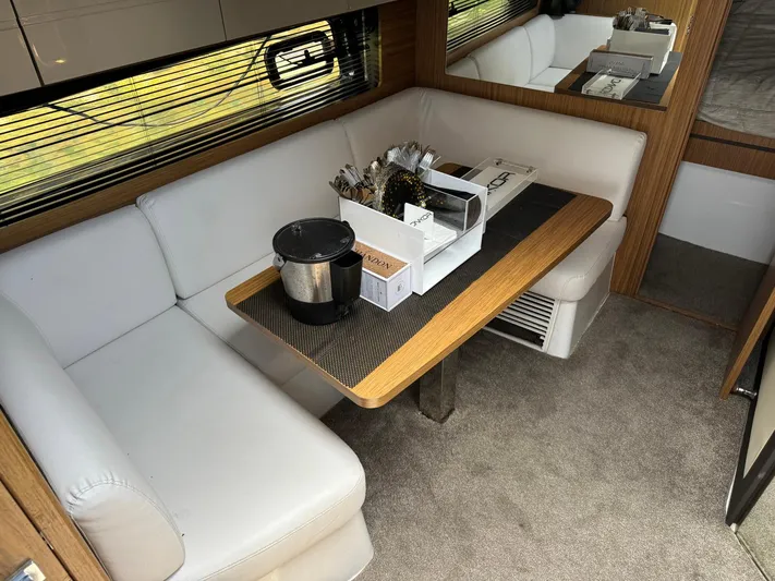 Onkor II Yacht Photos Pics Interior of 2015 Azimut Atlantis 43 yacht with cozy seating and dining table.