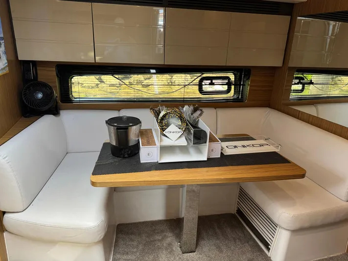 Onkor II Yacht Photos Pics Interior of 2015 Azimut Atlantis 43 yacht with dining area and modern decor.