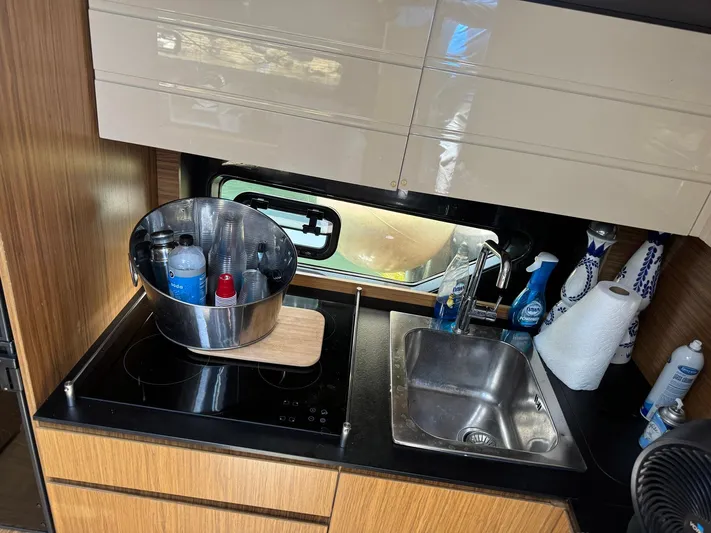 Onkor II Yacht Photos Pics Kitchen area of 2015 Azimut Atlantis 43 yacht with sink and countertop.