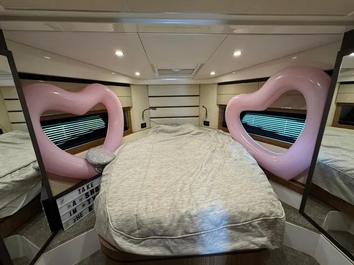 Onkor II Yacht Photos Pics Luxurious bedroom in 2015 Azimut Atlantis 43 yacht with heart-shaped decor.
