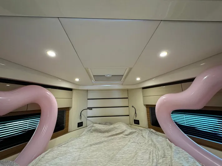 Onkor II Yacht Photos Pics Interior cabin of 2015 Azimut Atlantis 43 yacht, featuring modern lighting and cozy bedding.