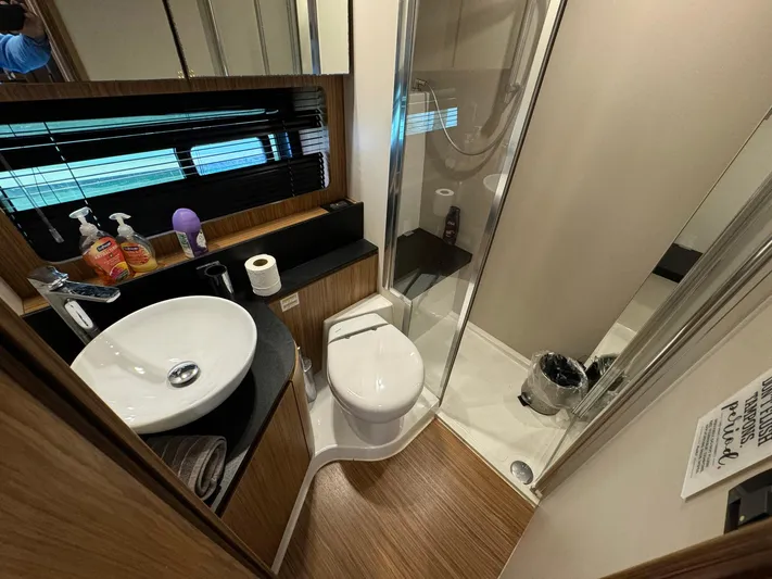 Onkor II Yacht Photos Pics Luxurious bathroom in 2015 Azimut Atlantis 43 yacht with modern fixtures and shower.