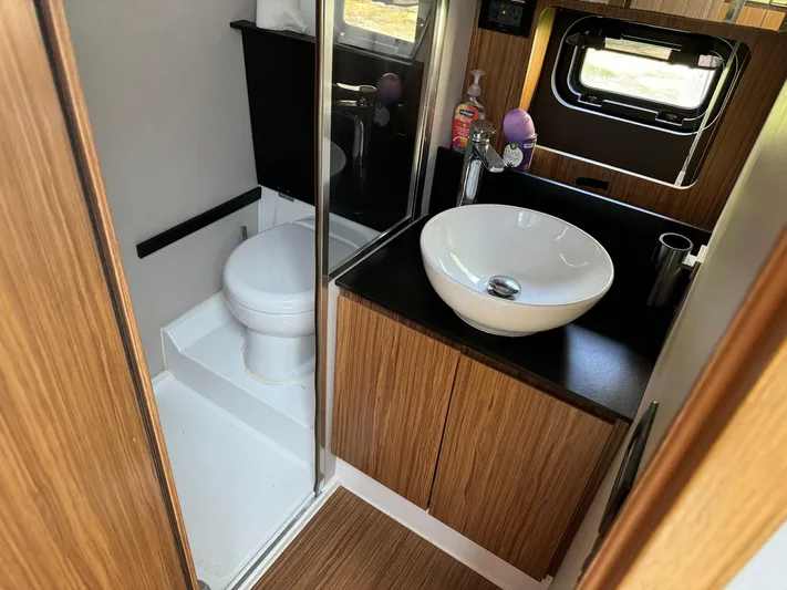 Onkor II Yacht Photos Pics Bathroom interior of 2015 Azimut Atlantis 43 yacht with modern sink and toilet.