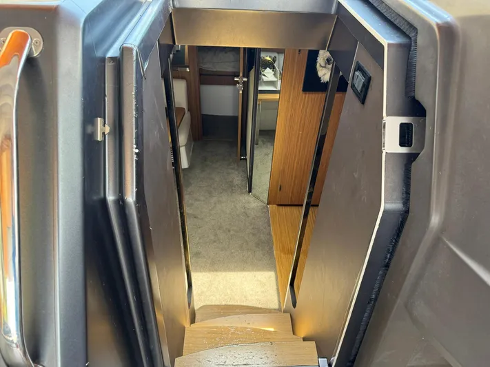 Onkor II Yacht Photos Pics Interior view of 2015 Azimut Atlantis 43 yacht, showing stairs and cabin entrance.