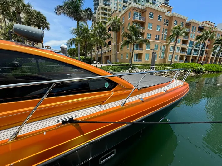 Onkor II Yacht Photos Pics 2015 Azimut Atlantis 43 yacht docked near waterfront buildings and palm trees.