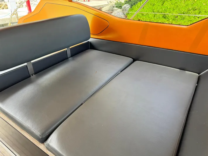 Onkor II Yacht Photos Pics Luxurious seating on 2015 Azimut Atlantis 43 yacht, featuring sleek black cushions.