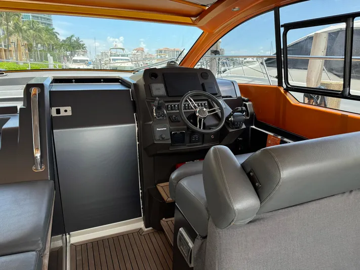 Onkor II Yacht Photos Pics 2015 Azimut Atlantis 43 yacht cockpit with modern steering and controls.