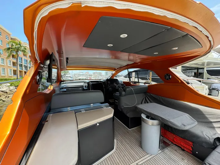 Onkor II Yacht Photos Pics 2015 Azimut Atlantis 43 yacht interior with orange accents and modern seating.