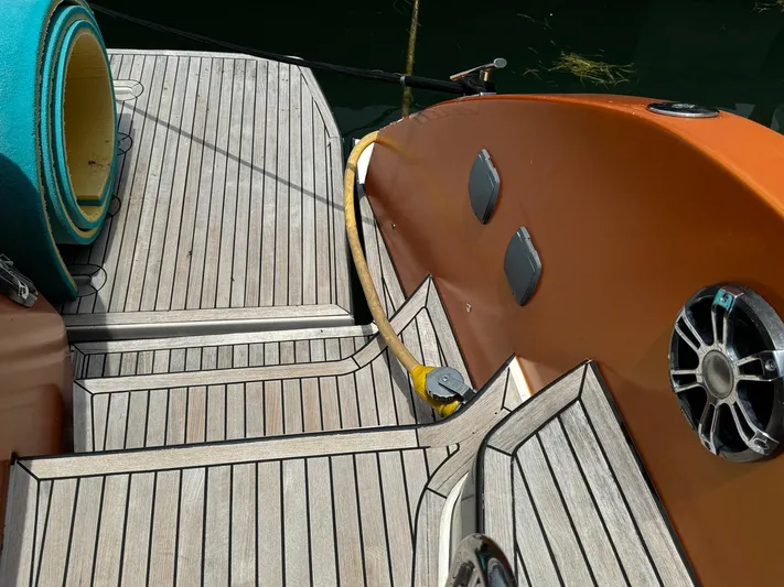 Onkor II Yacht Photos Pics Deck of 2015 Azimut Atlantis 43 yacht with wooden flooring and speaker.