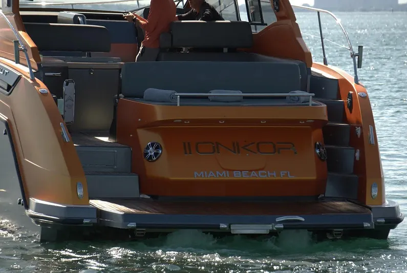 Onkor II Yacht Photos Pics 2015 Azimut Atlantis 43 yacht on water, rear view, Miami Beach, orange exterior.