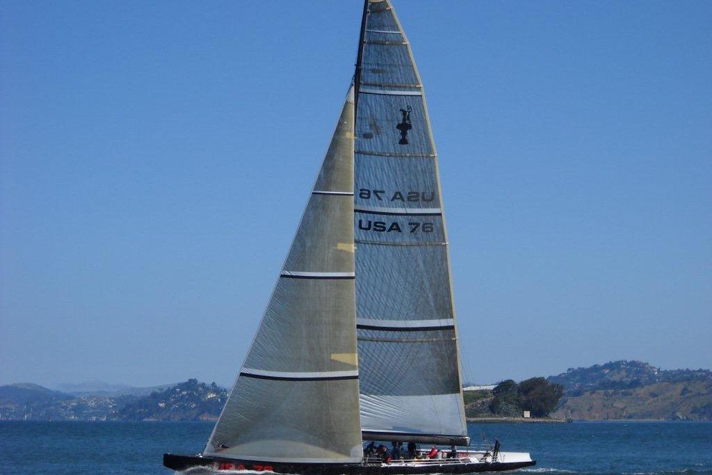 Sailing yacht "USA 76" from 2002 International America's Cup Class on open water.