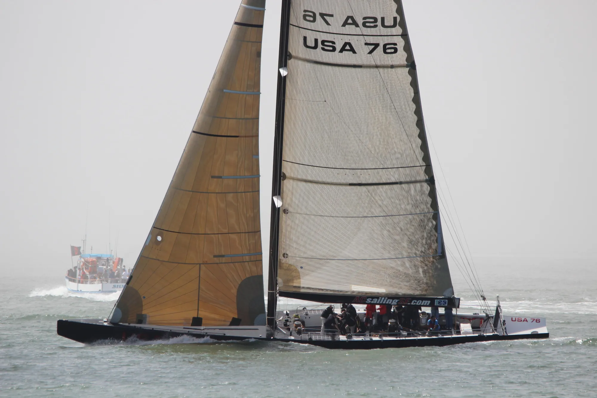Sailing yacht USA 76, International Americas Cup Class, 2002, on open water.