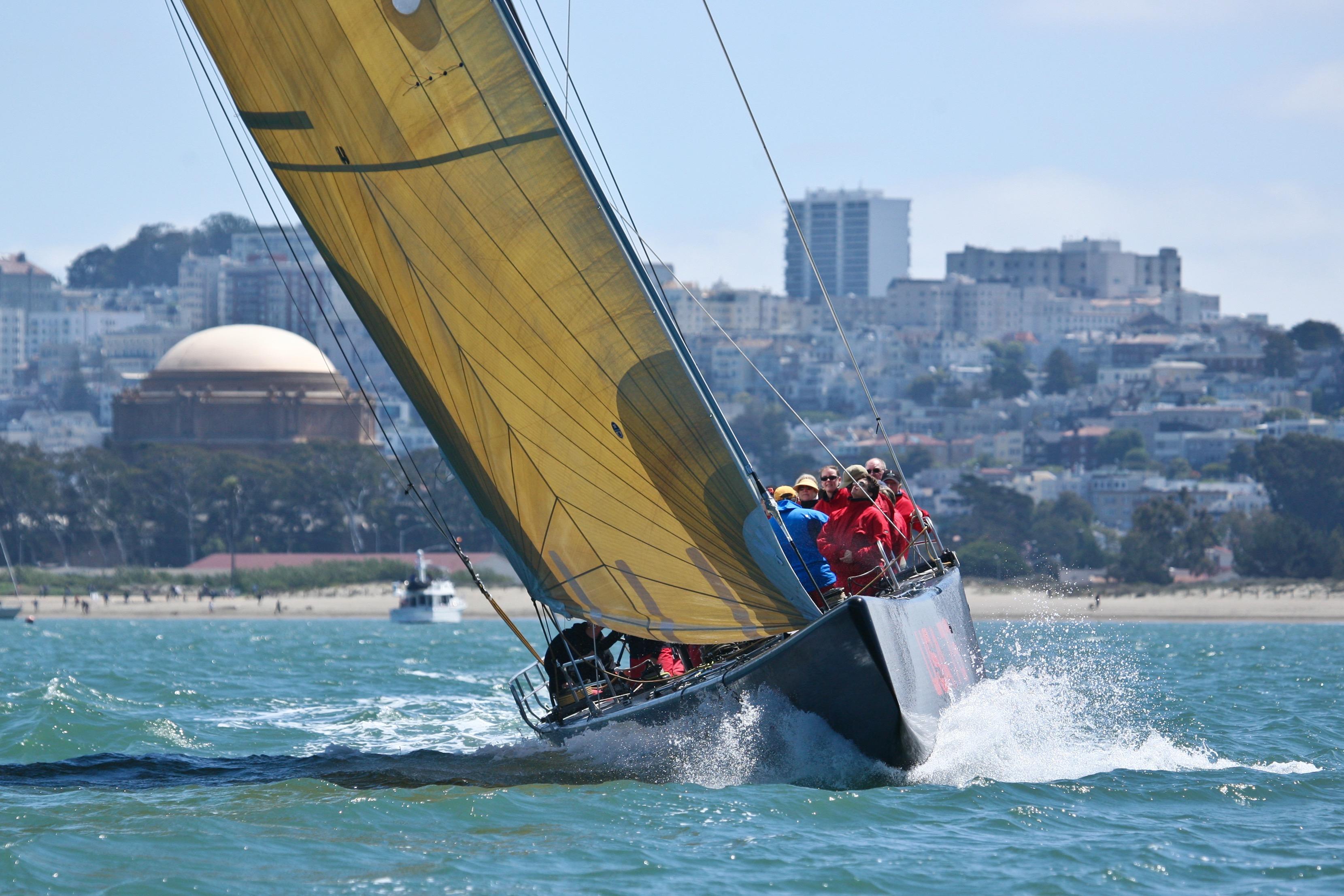 Sailing yacht with yellow sail in action, 2002 International Americas Cup Class.