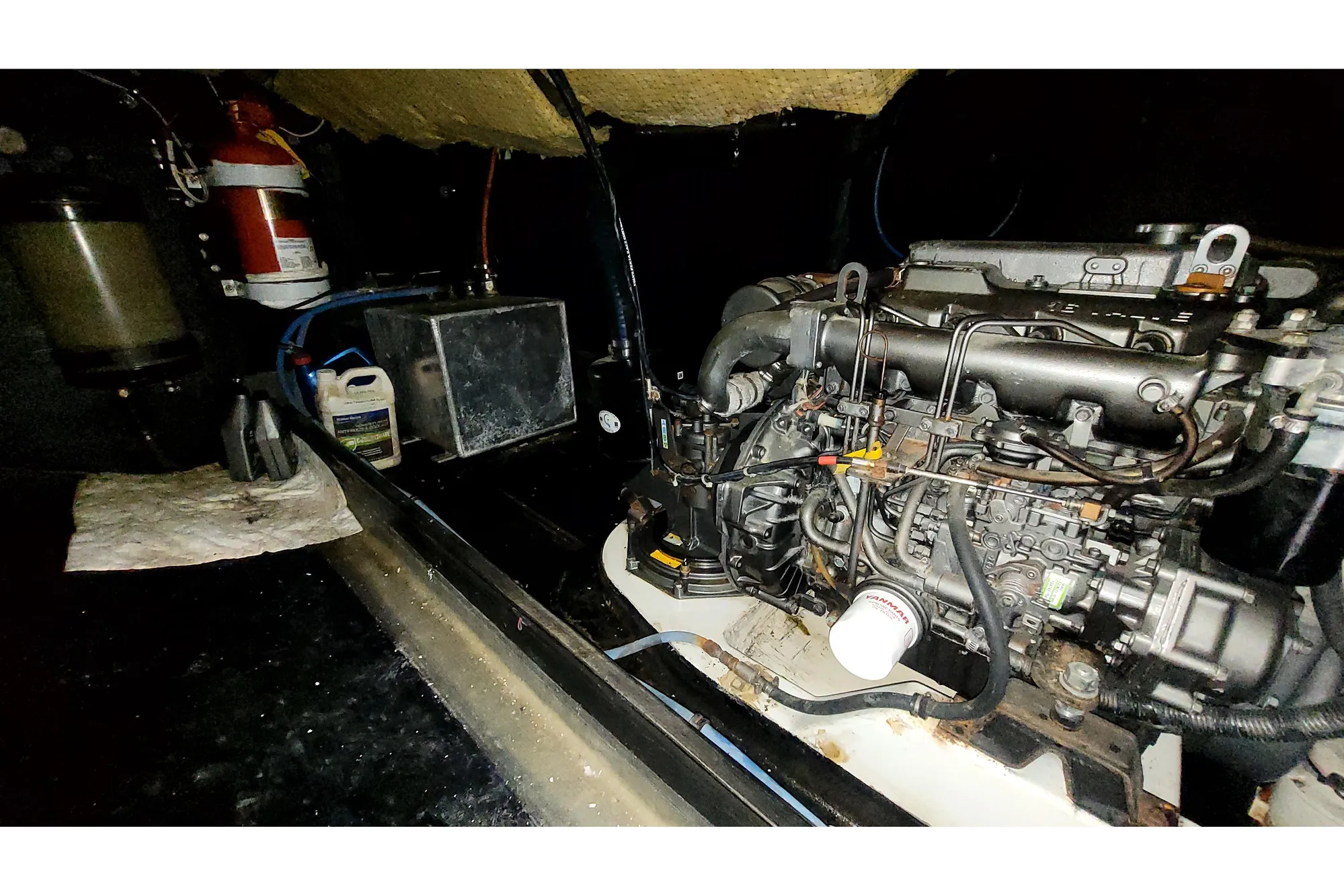 Engine room of 2002 Custom International Americas Cup Class yacht, featuring detailed machinery.