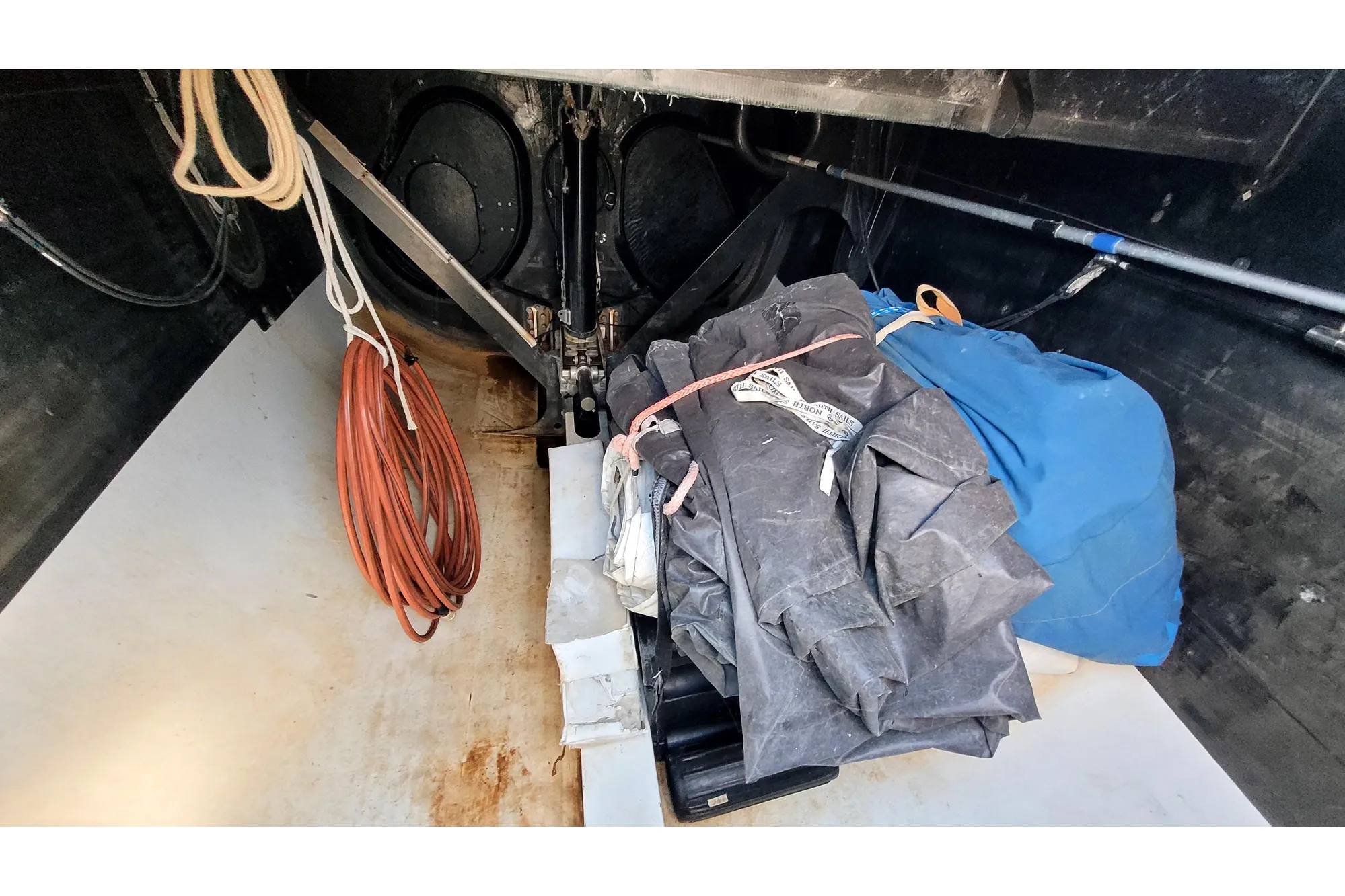 Interior of a 2002 Custom International Americas Cup Class yacht with ropes and sails.