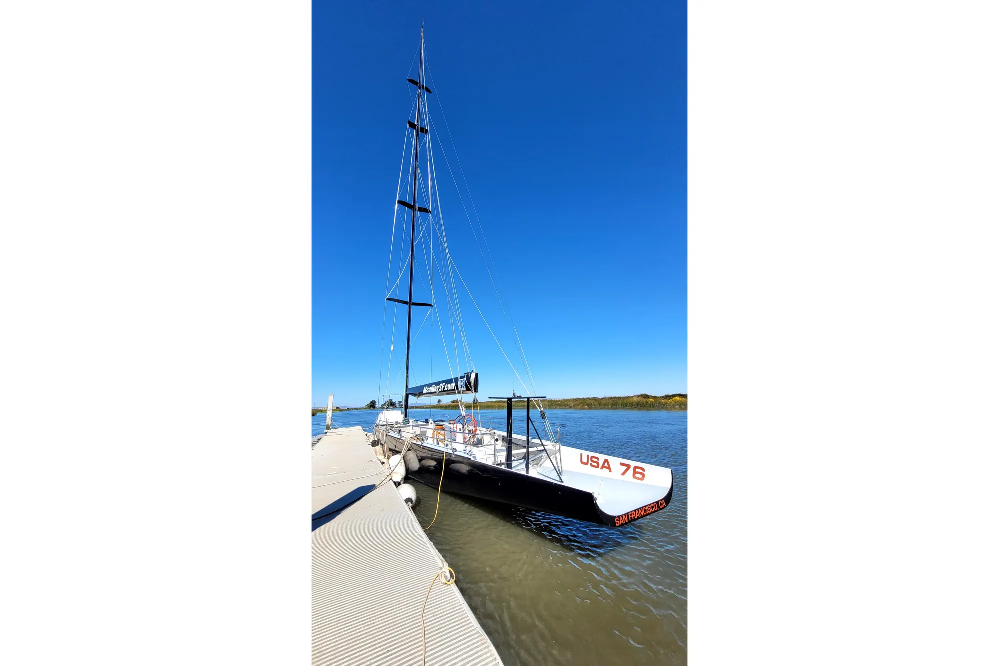 Sailing yacht USA 76, Custom International Americas Cup Class, docked, 2002 model.