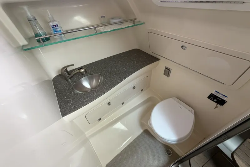  Yacht Photos Pics Interior of 2019 Boston Whaler 315 Conquest with sink and toilet.