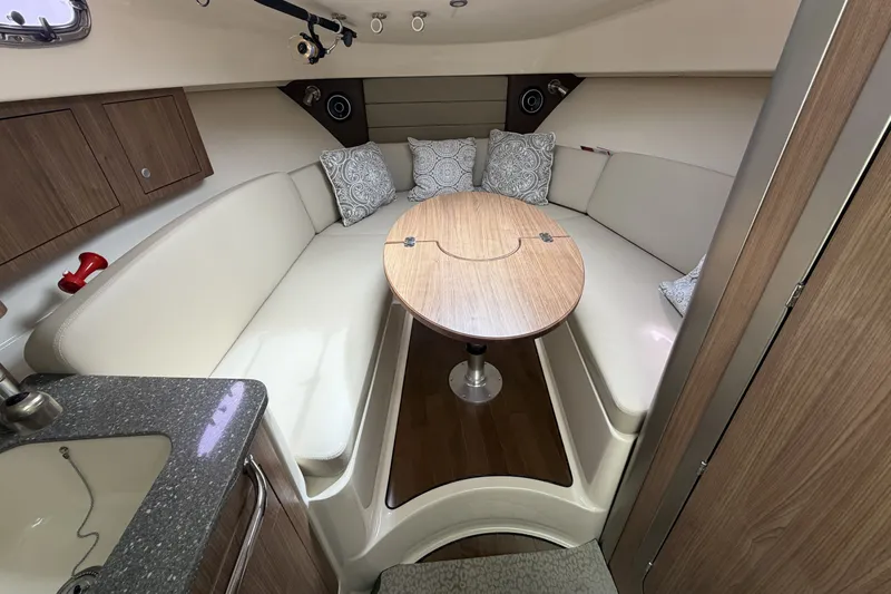  Yacht Photos Pics Interior of 2019 Boston Whaler 315 Conquest with cozy seating area.