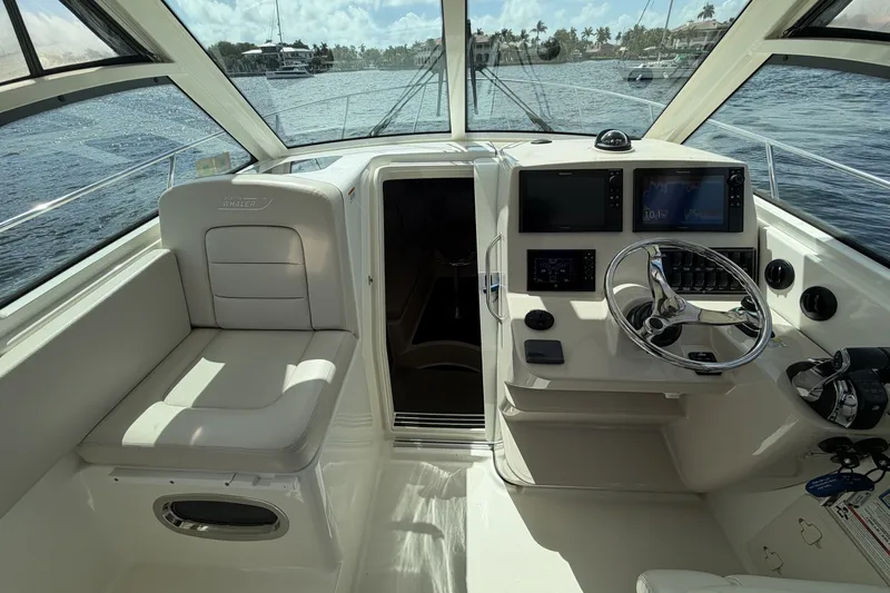  Yacht Photos Pics Interior of 2019 Boston Whaler 315 Conquest with helm station.