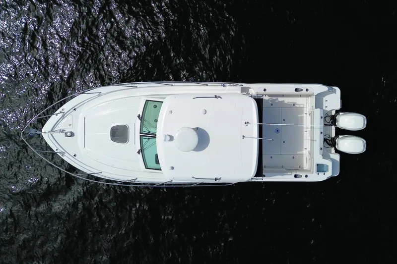  Yacht Photos Pics Aerial view of a 2019 Boston Whaler 315 Conquest boat on water.