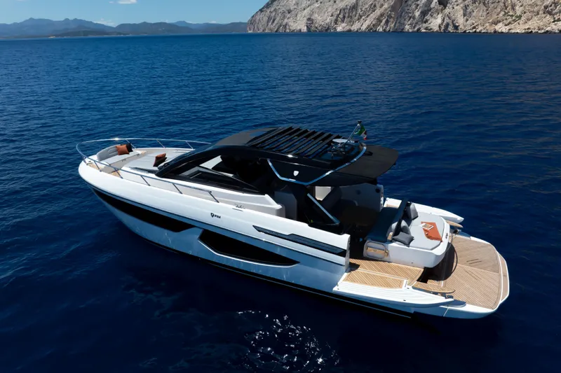 Yacht Photos Pics Luxury 2026 FIM 440 Regina yacht cruising on clear blue waters.