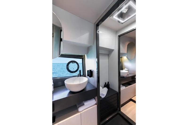  Yacht Photos Pics Luxurious bathroom interior of 2026 FIM 440 Regina yacht with ocean view.