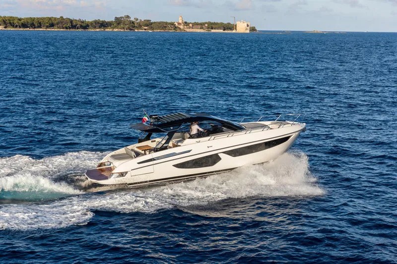  Yacht Photos Pics 2026 FIM 440 Regina yacht cruising on open sea with scenic coastline.