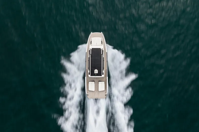  Yacht Photos Pics Aerial view of 2026 Sunreef Ultima 55 yacht cruising on open water.