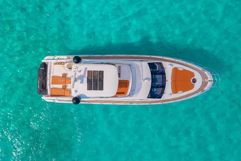 Golden Sun Yacht Photos Pics Aerial view of 2011 Azimut 58 yacht on turquoise water.