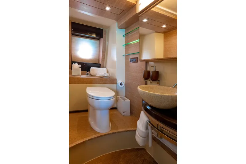 Golden Sun Yacht Photos Pics Luxurious bathroom interior of 2011 Azimut 58 yacht with modern fixtures and elegant design.