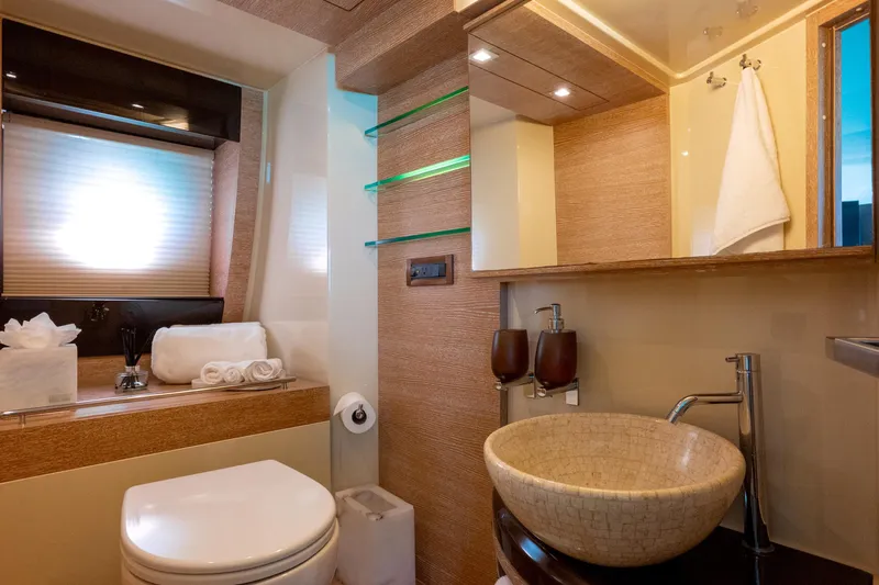 Golden Sun Yacht Photos Pics Luxurious bathroom in 2011 Azimut 58 yacht with modern fixtures and elegant design.
