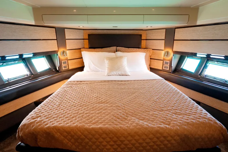 Golden Sun Yacht Photos Pics Luxurious bedroom interior of 2011 Azimut 58 yacht with elegant bedding and modern design.