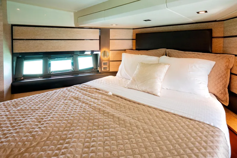 Golden Sun Yacht Photos Pics Luxurious bedroom interior of 2011 Azimut 58 yacht with elegant bedding and modern design.