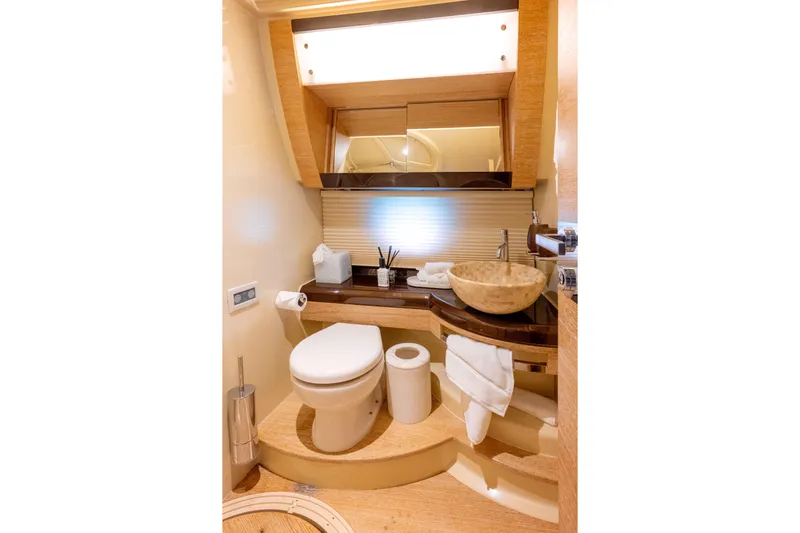 Golden Sun Yacht Photos Pics Luxurious bathroom in 2011 Azimut 58 yacht with modern fixtures and elegant design.