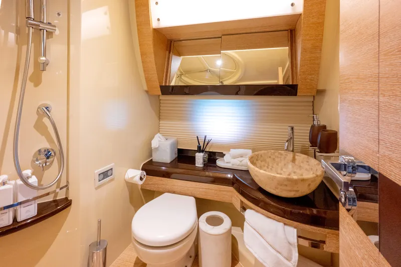 Golden Sun Yacht Photos Pics Luxurious bathroom in 2011 Azimut 58 yacht with modern fixtures and elegant design.