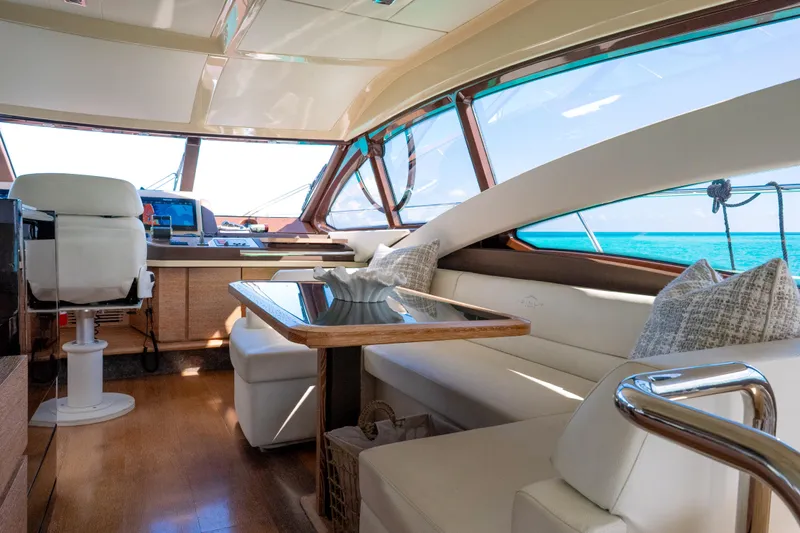 Golden Sun Yacht Photos Pics Luxurious interior of 2011 Azimut 58 yacht with elegant seating and ocean view.