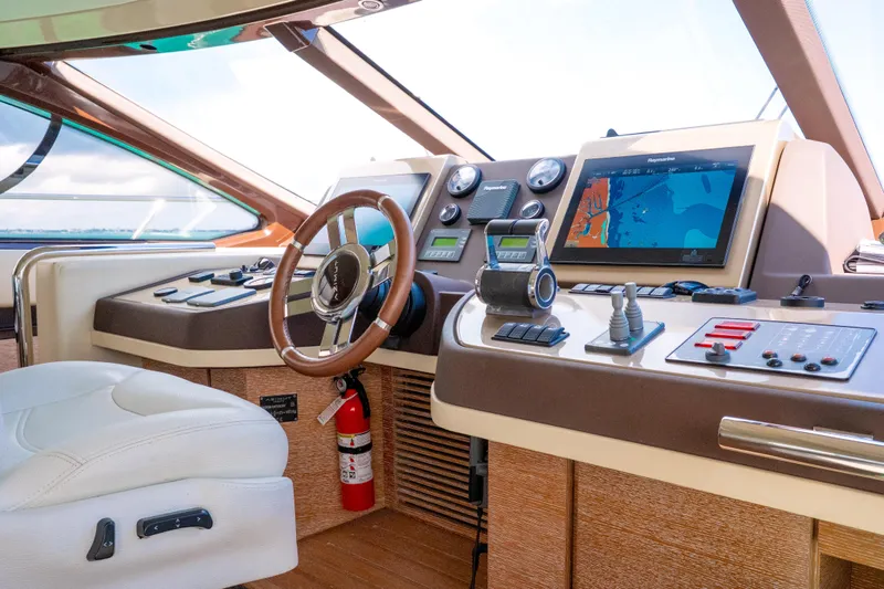 Golden Sun Yacht Photos Pics Cockpit of 2011 Azimut 58 yacht with navigation screens and controls.