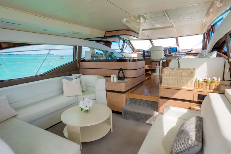 Golden Sun Yacht Photos Pics Luxurious interior of 2011 Azimut 58 yacht with elegant seating and panoramic windows.